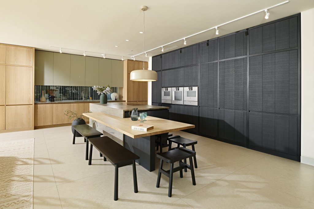 view across the waterfall island and low breakfast bar to the corner of the Hidden Lake kitchen