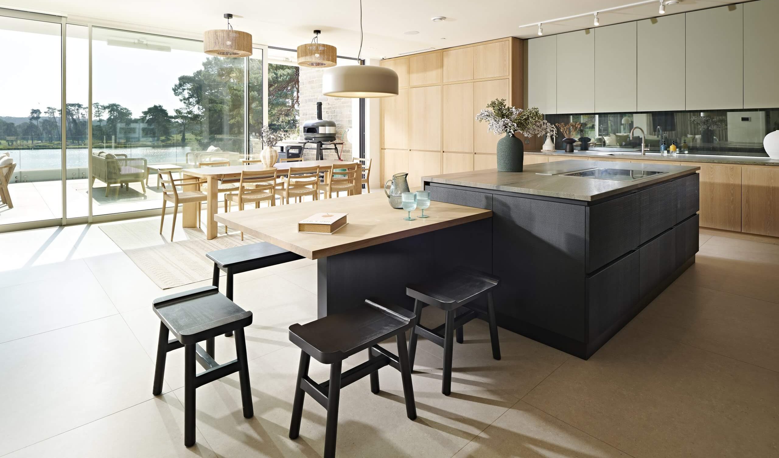 a view looking across the island through the window to the lake