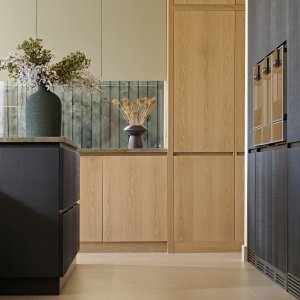 low shot between the black oak island and back wall towards the natural oak sink wall