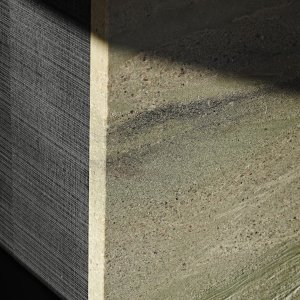 Detail of the waterfall island showing Verde Lara granite and black stained rough cut oak